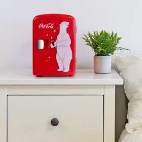 Koolatron Coca-Cola 4L mini-fridge open-lid reveals removable shelf for easy organization.