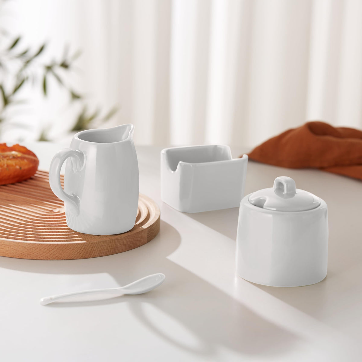 KooK creamer dispenser with lid and spoon supports easy pouring