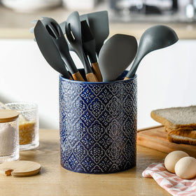 KOOV sturdy-base utensil holder resists tipping for stable storage.