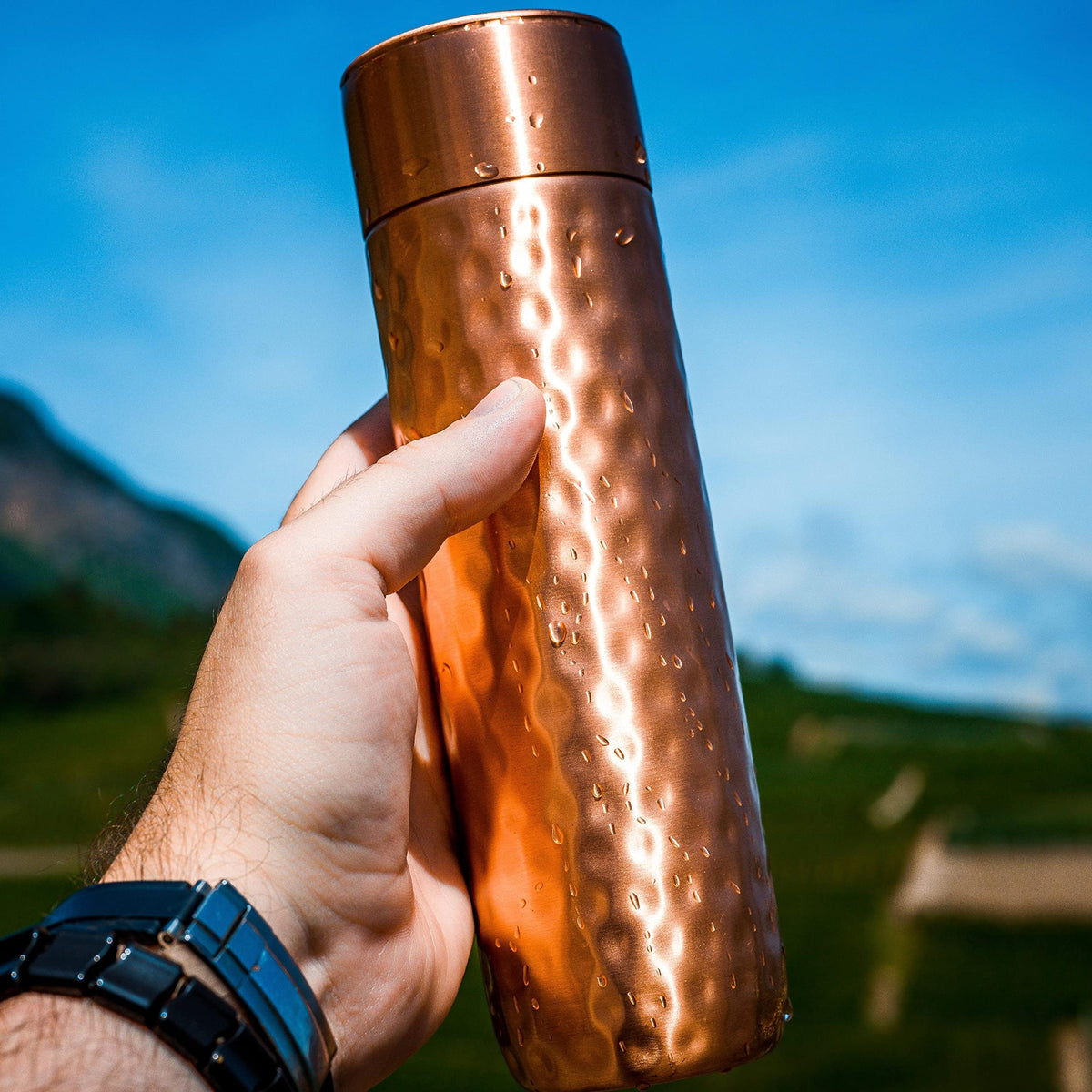 Kosdeg copper water bottle on office desk supports easy daytime hydration.