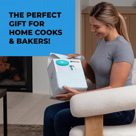 KPKitchen turquoise batter dispenser in use for pouring batter