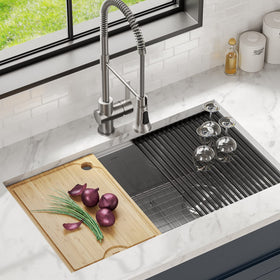 Kraus Kore bamboo cutting board on ledge, ideal for over-sink prep