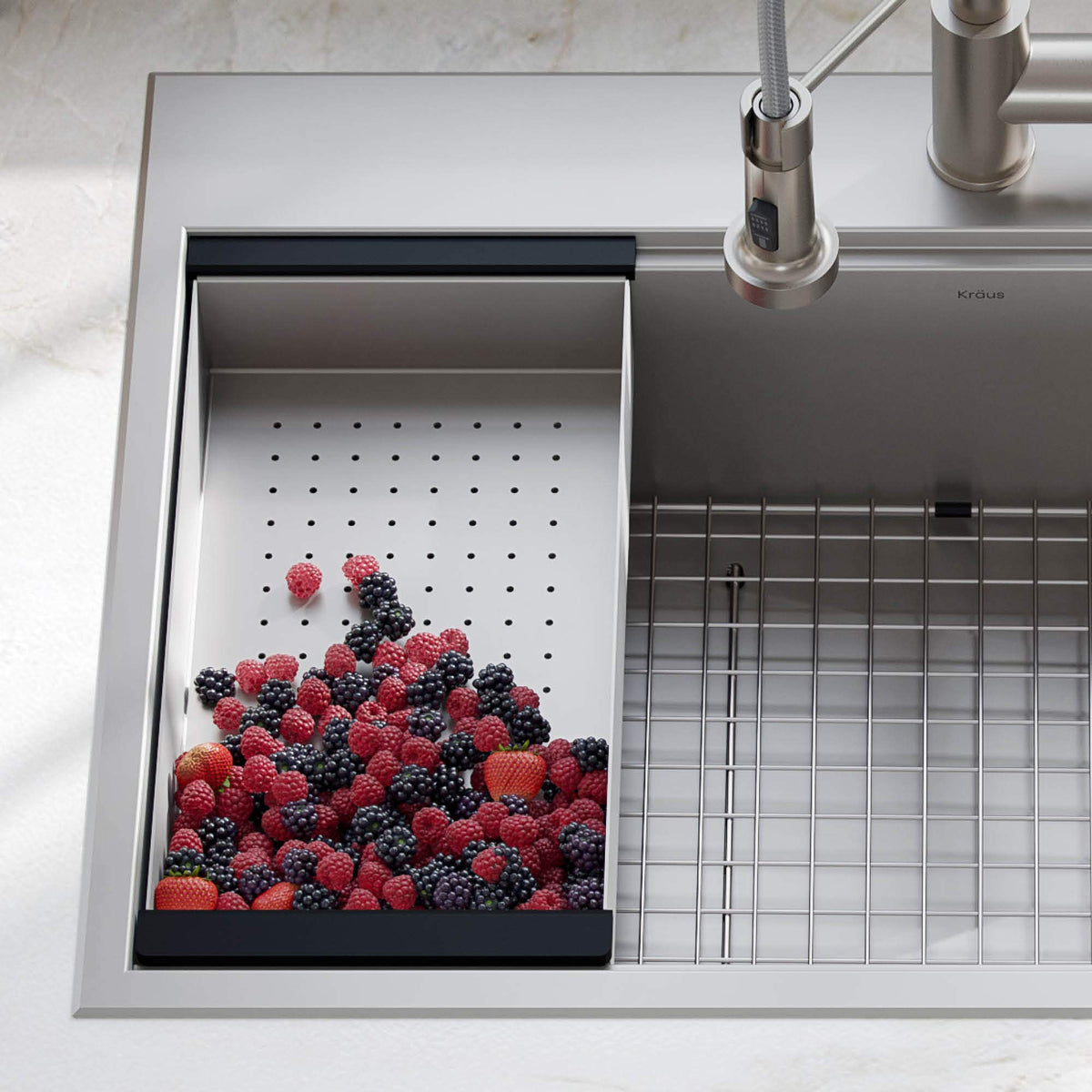 Kraus workstation colander on the sink ledge for hands-free draining.