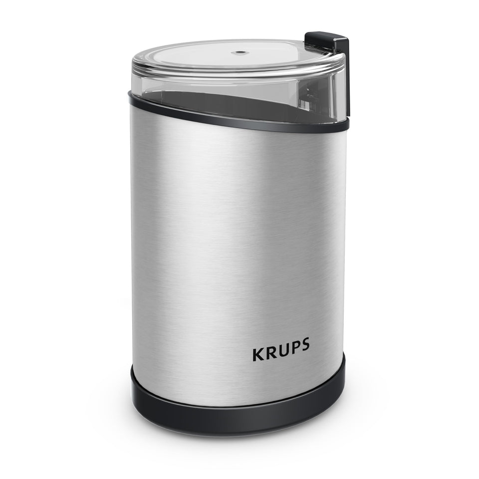KRUPS electric coffee grinder with beans ready for espresso aroma at home.