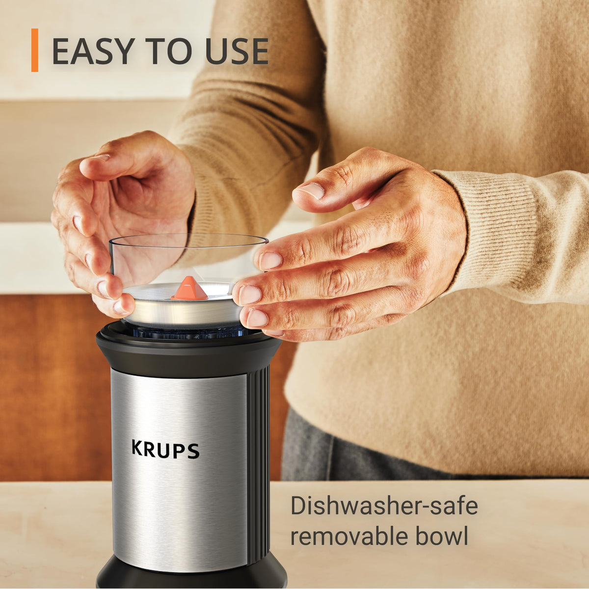 KRUPS electric blade coffee grinder lid operation demonstrates push-controlled grinding.