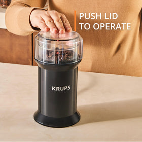 KRUPS lid-press control enables easy, precise grinding.