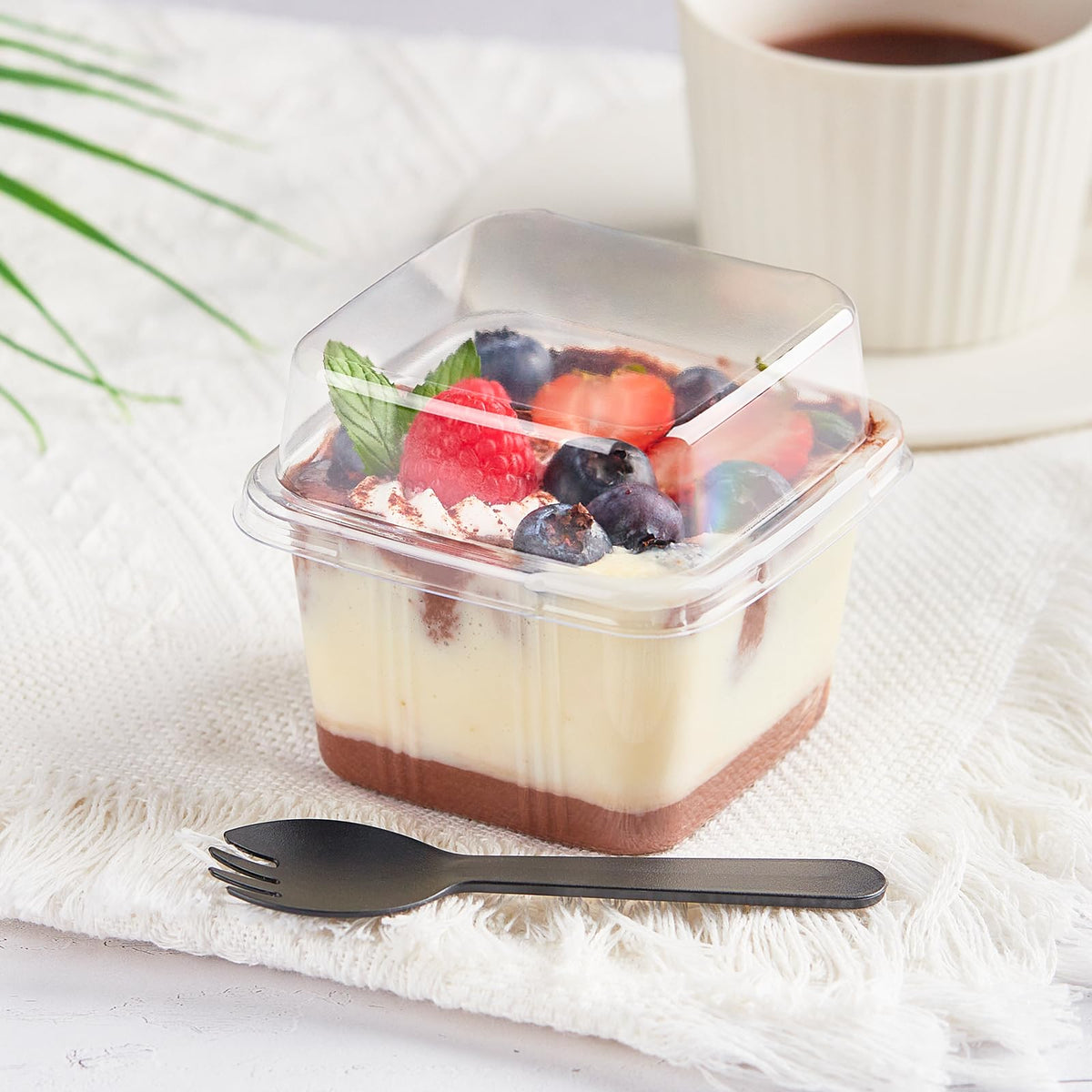 Kucoele transparent cups showcase layered parfaits with vibrant toppings.