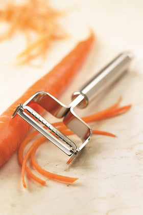 Kuhn Rikon julienne peeler with ultra-sharp blade creates thin, even strips.