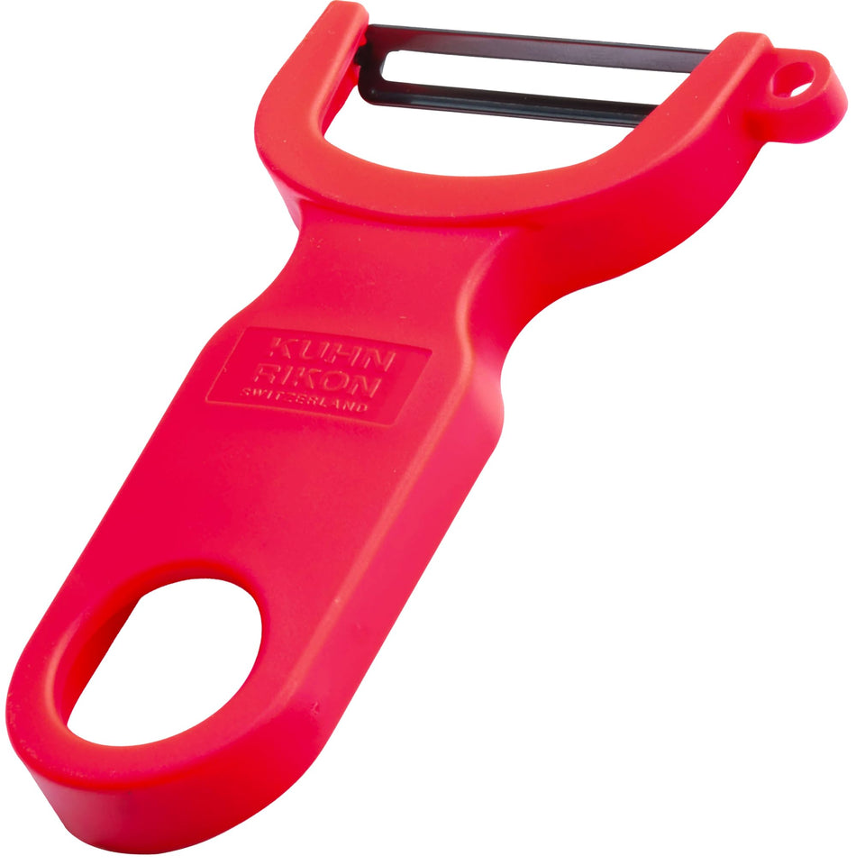Kuhn Rikon red original Swiss peeler blade close-up for razor-thin peels