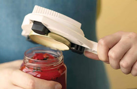 Kuhn Rikon Strain-Free Opener stored in a drawer for quick access