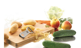 Kuhn Rikon Swiss Metal Peeler showing potato eye remover in action.