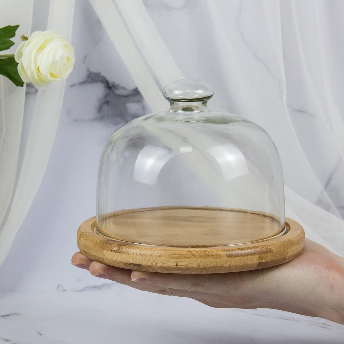 KVMORZE bell jar used as a decorative fruit display on a table