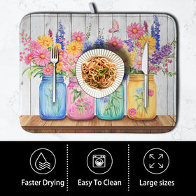 Kwlegh Daisy mat sits under a dish rack offering counter protection