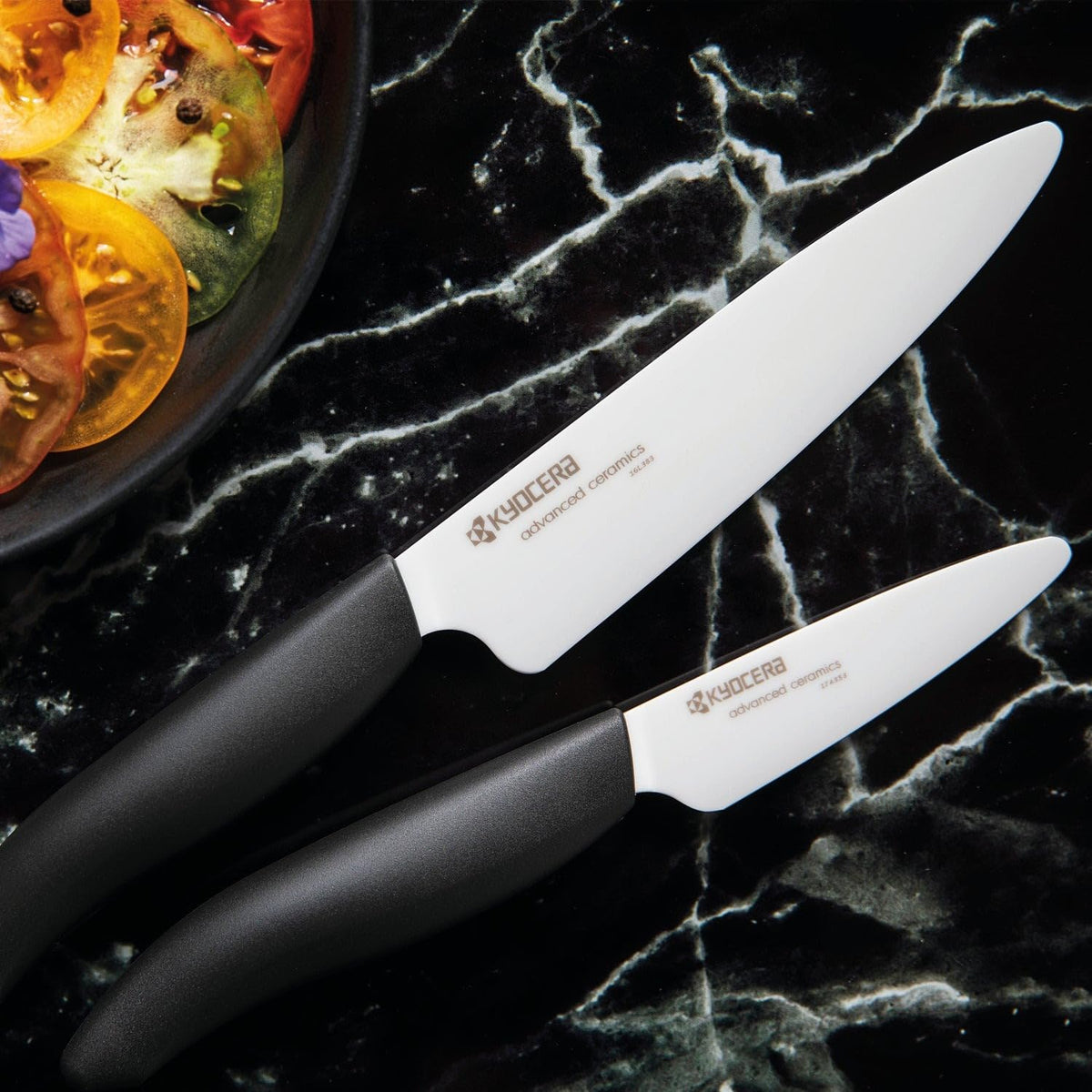 Kyocera 3-inch paring knife in hand showing ultra-sharp ceramic edge for quick prep
