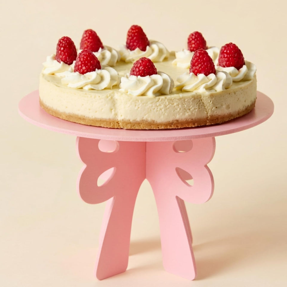 Lallisa Bow Cake Stand Pink forms a stylish centerpiece for birthdays and weddings.
