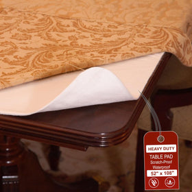 LAMINET deluxe cushioned table pad with vinyl top protects 52x108 table from spills.