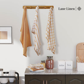 Lane Linen towel beside a cup and utensils demonstrating versatility.