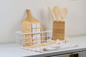 Lane Linen quick-drying towel absorbing spills in a busy kitchen.