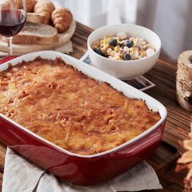 Lareina rectangular stoneware bakeware in red, perfect for casseroles and potlucks.