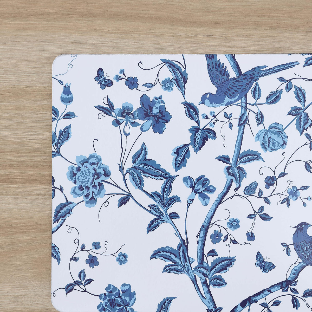 Set of four Laura Ashley cork placemats laid on dining table