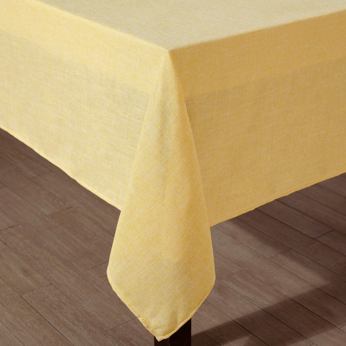 Rectangular-fit Laura Ashley Harper tablecloth drapes neatly across a long dining table.