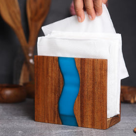 LAVAUK turquoise epoxy napkin dispenser on a dining table for organized napkins.