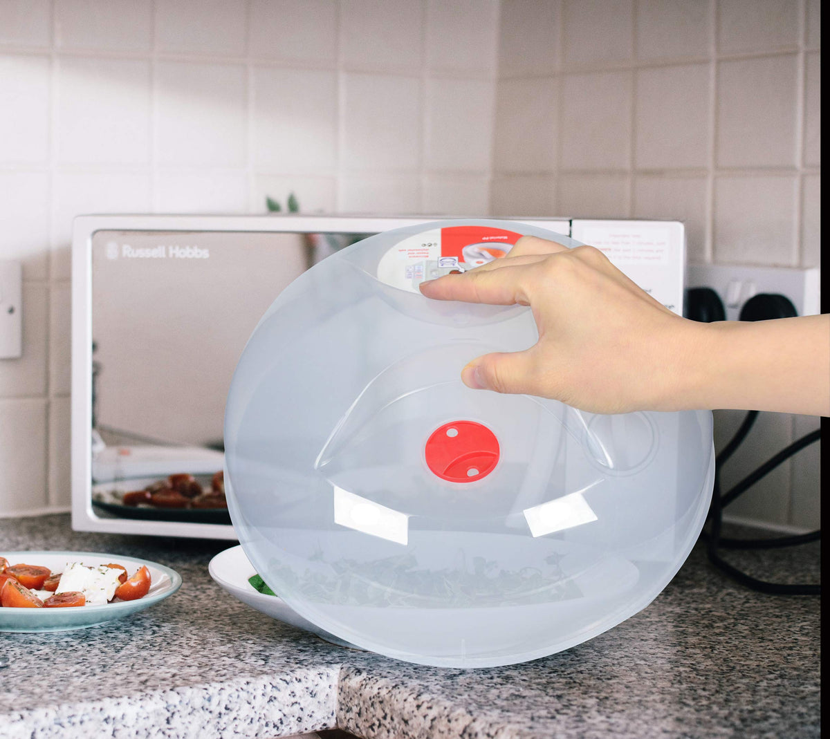 Layron splatter guard with steam vent promotes even reheating and moisture control.