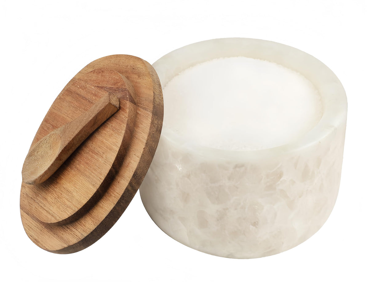 Lc.Courage salt and pepper cellar with marble lid for elegant spice storage.