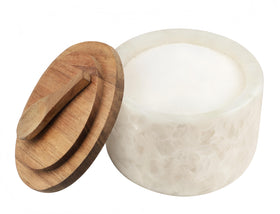 Lc.Courage salt and pepper cellar with marble lid for elegant spice storage.