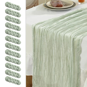 Le courant 12pc 10ft cheesecloth table runner in sage green enhances rustic tables.