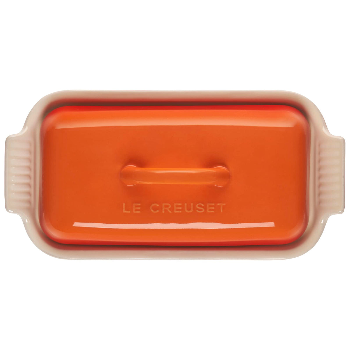 Le Creuset Heritage Flame butter dish close-up shows glossy glaze reducing sticking.