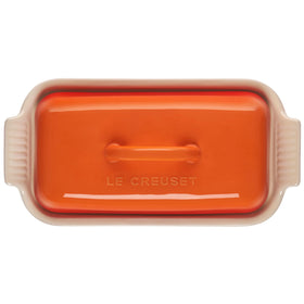 Le Creuset Heritage Flame butter dish close-up shows glossy glaze reducing sticking.