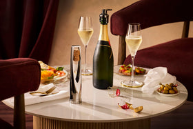 Le Creuset Champagne Crown Sealer side view secures carbonation and stores upright