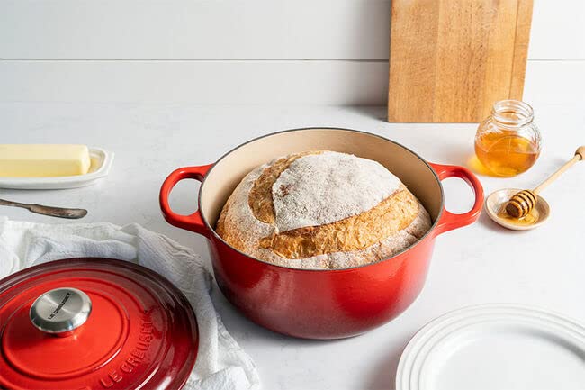 Le Creuset Cerise round on stove showing even heat distribution