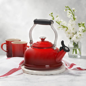 Le Creuset Marseille kettle enamel close-up showing glossy non-reactive glaze.