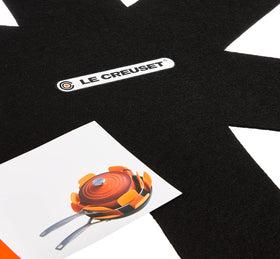 Le Creuset protectors are machine washable for easy care after storage.