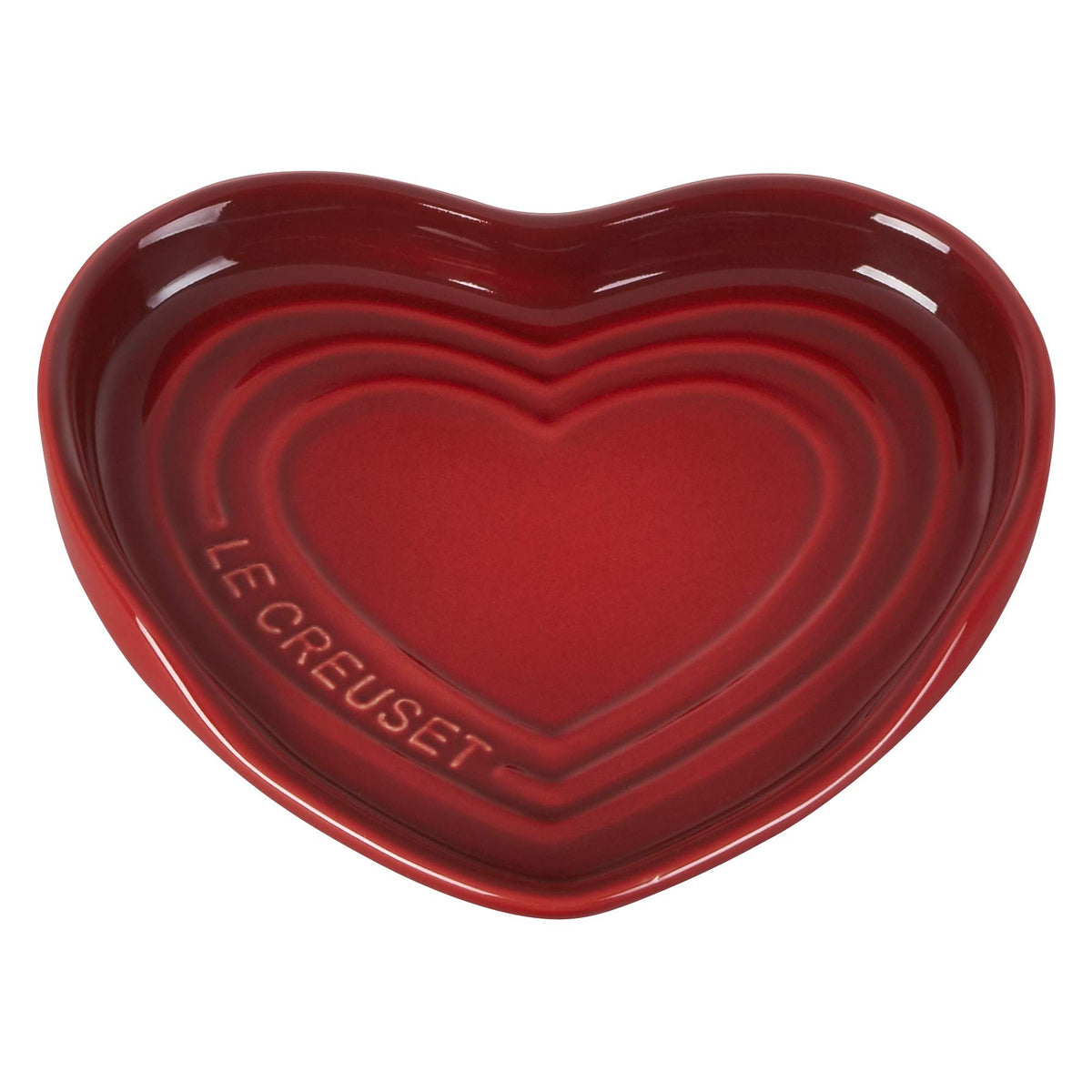Le Creuset heart spoon rest cerise in use, protecting surfaces from drips.