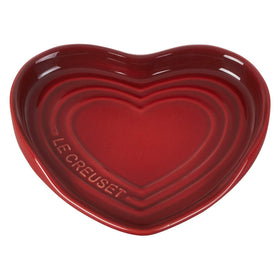 Le Creuset heart spoon rest cerise in use, protecting surfaces from drips.