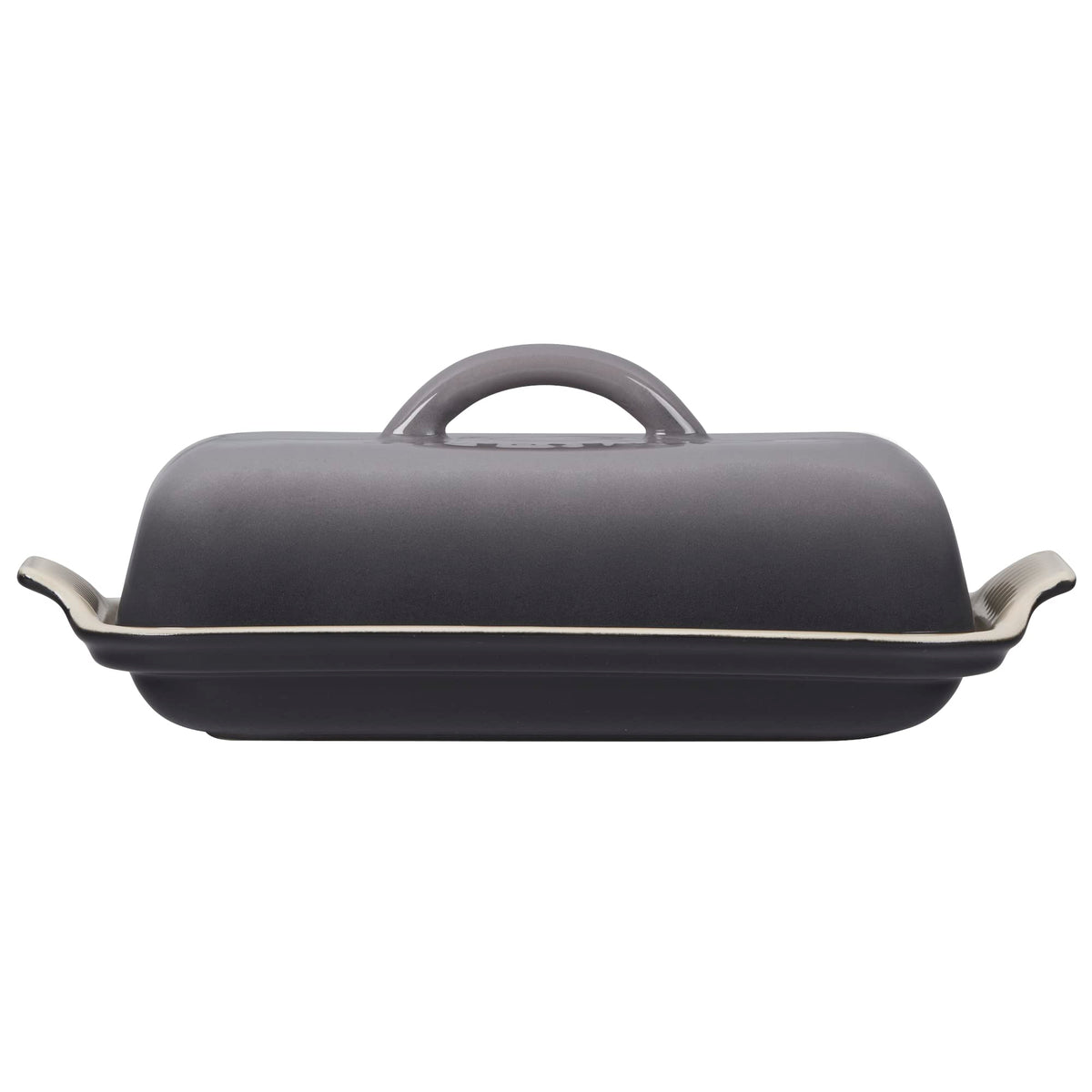 Le Creuset Heritage Butter Dish Oyster on table, durable glaze resists chips and stains.