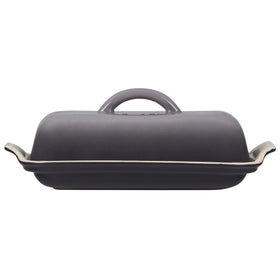 Le Creuset Heritage Butter Dish Oyster on table, durable glaze resists chips and stains.