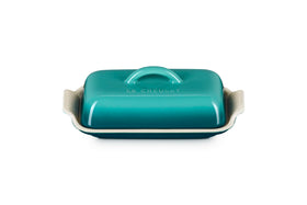 Le Creuset Heritage Butter Dish Riviera top view showcases vibrant glaze and sturdy finish.