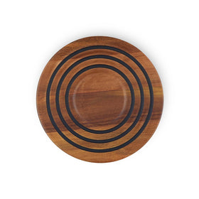 Le Creuset magnetic wooden trivet in acacia wood showing the magnet for oven-to-table use.