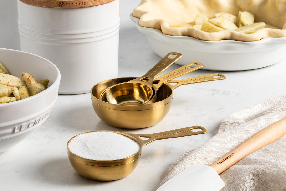 Le Creuset measuring cup set with gold finish, 1 cup for larger quantity prep.