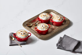 Le Creuset Cerise cocotte stacked for compact storage