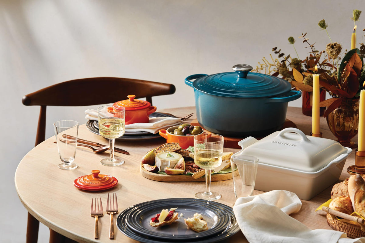 Le Creuset Mini Round Cocotte 8oz Flame, serving-ready with vibrant color.