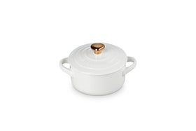 Le Creuset Mini Round Cocotte 8oz white with gold heart knob ensures even heat distribution.
