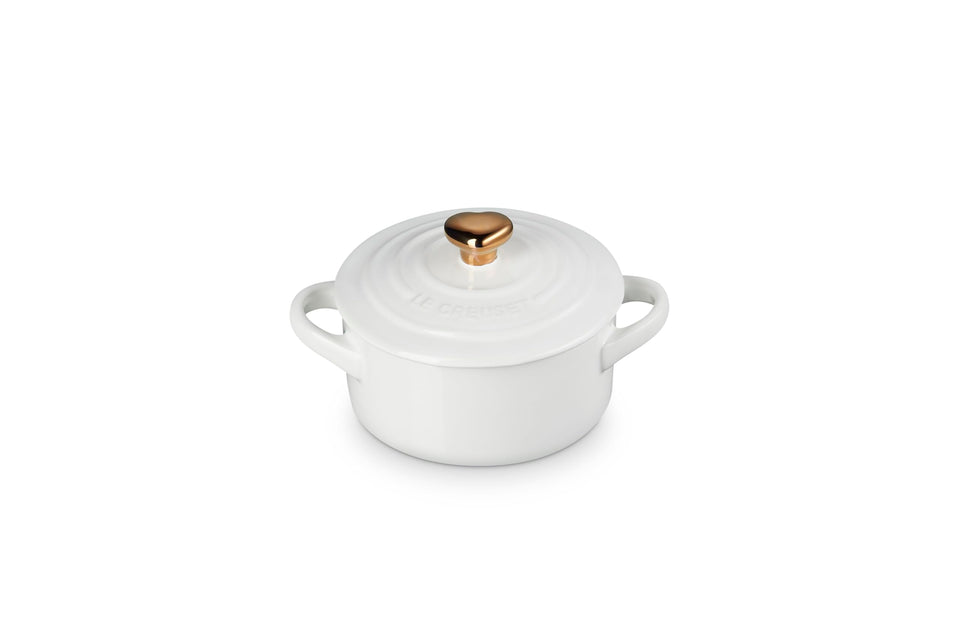 Le Creuset Mini Round Cocotte 8oz white with gold heart knob ensures even heat distribution.