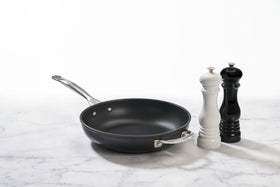 Le Creuset pepper mill in white featuring a durable ceramic grinder for smooth grinding.