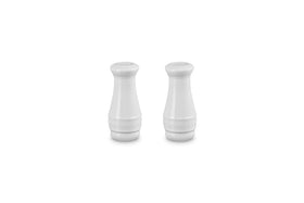 Le Creuset salt and pepper shakers front view with durable enamel finish resisting odors.