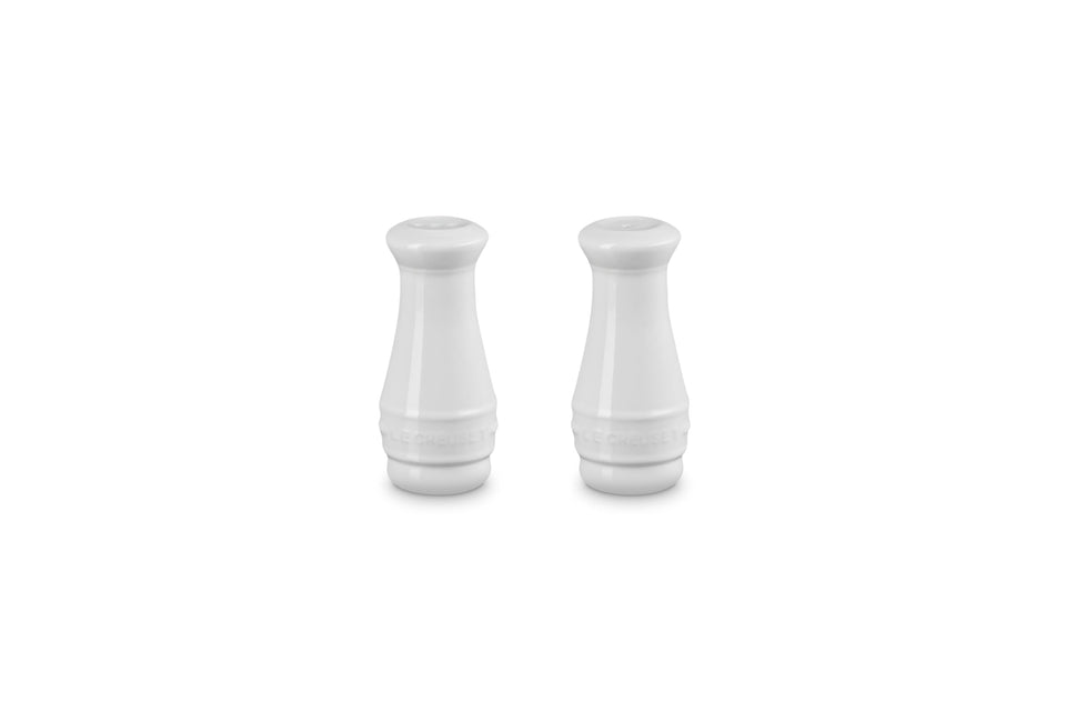 Le Creuset salt and pepper shakers front view with durable enamel finish resisting odors.
